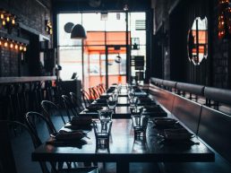 clear glass cup on brown wooden table